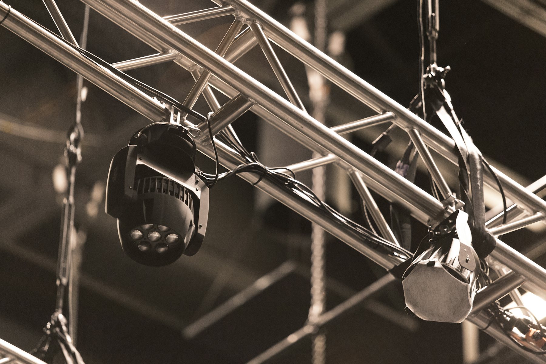 Close-up of a stage lighting rig and truss, backstage at a live production